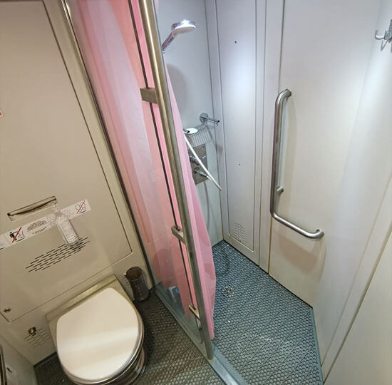 Toilet and shower in a second class carriage.